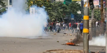 Kenyan citizens protest death of blogger in police custody, as police fire teargas